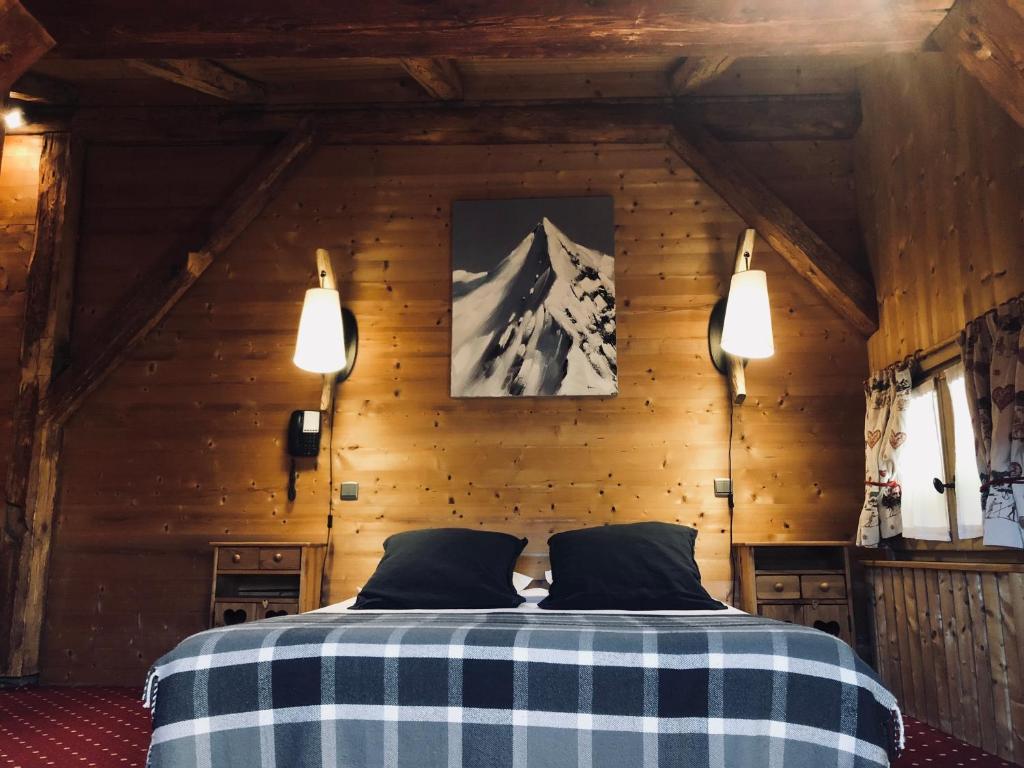 Postel nebo postele na pokoji v ubytování Le Coin Savoyard