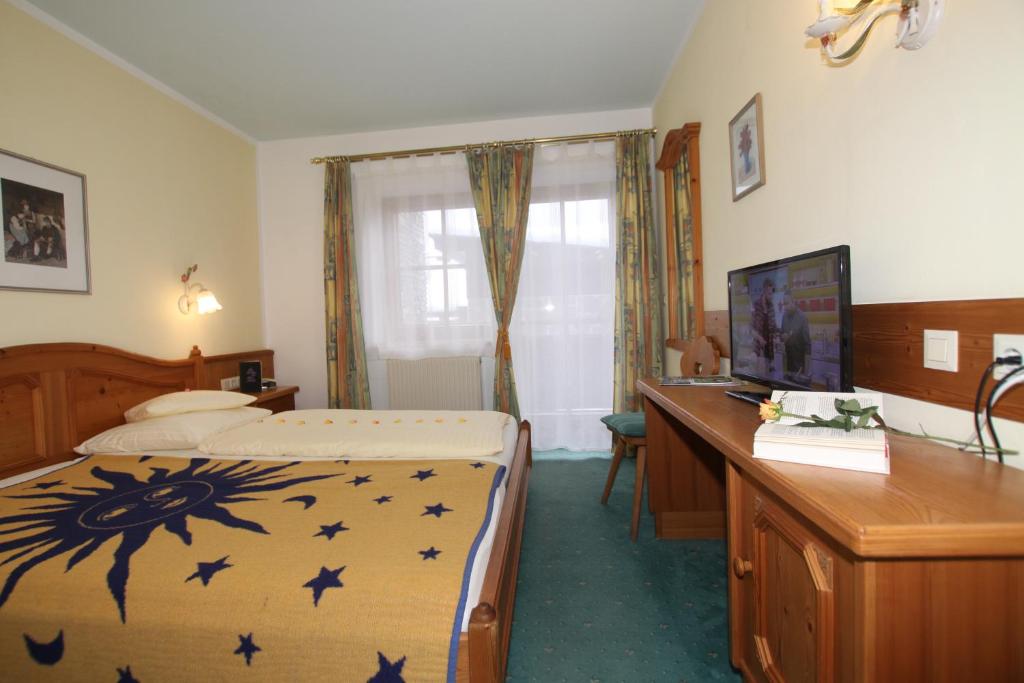 Postel nebo postele na pokoji v ubytování Hotel Sonne