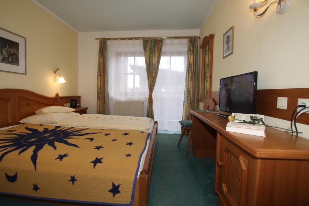 Postel nebo postele na pokoji v ubytování Hotel Sonne