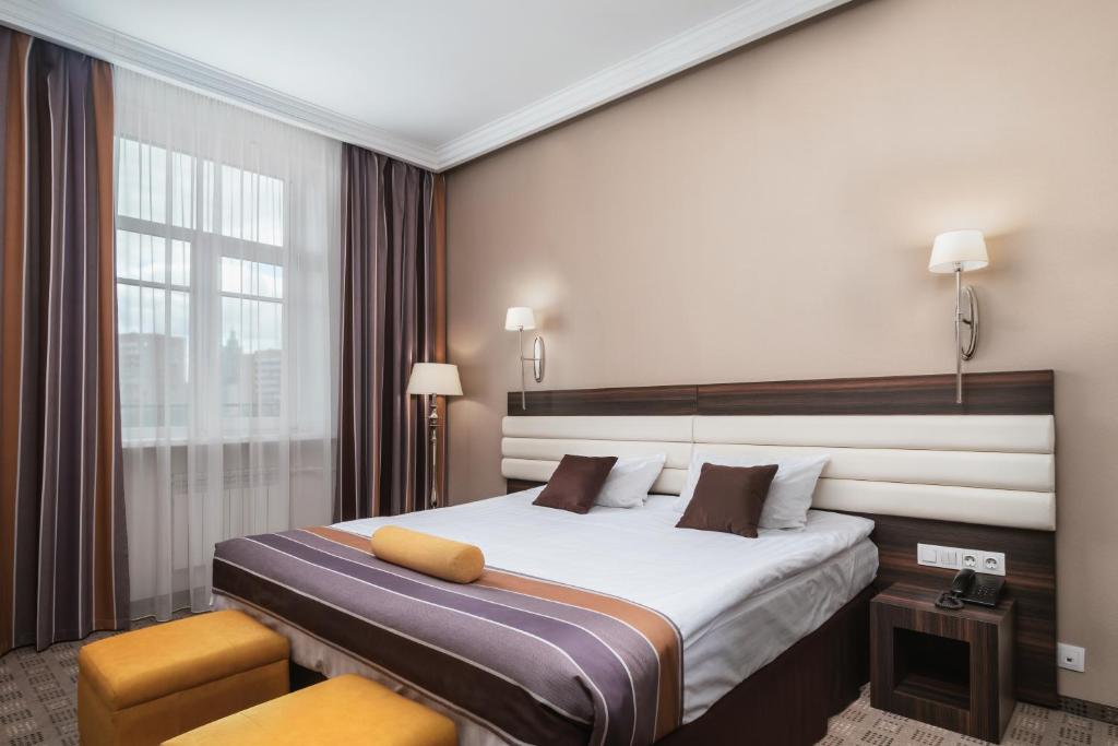 Кровать или кровати в номере Гостиница Славянка Москва