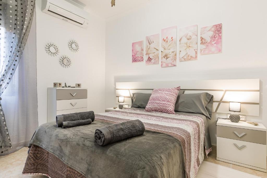 Posteľ alebo postele v izbe v ubytovaní APARTAMENTOS TURISTICOS TURISToledo