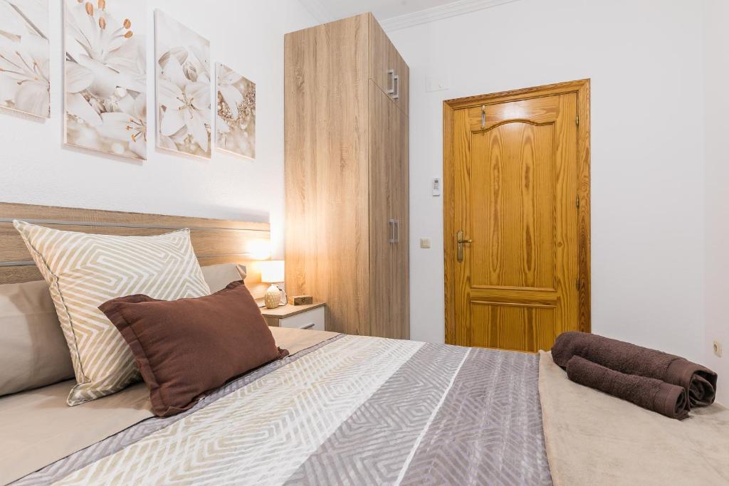 Posteľ alebo postele v izbe v ubytovaní APARTAMENTOS TURISTICOS TURISToledo