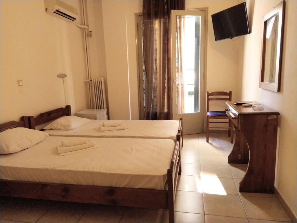Postel nebo postele na pokoji v ubytování Delfini Hotel