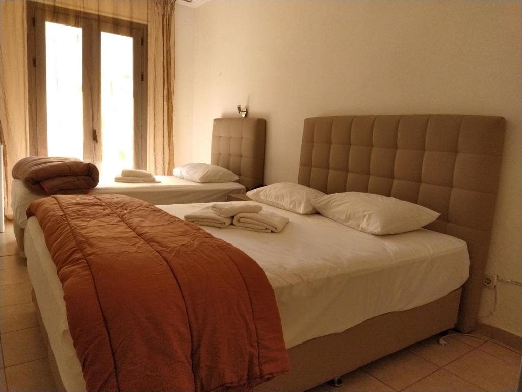 Postel nebo postele na pokoji v ubytování Delfini Hotel