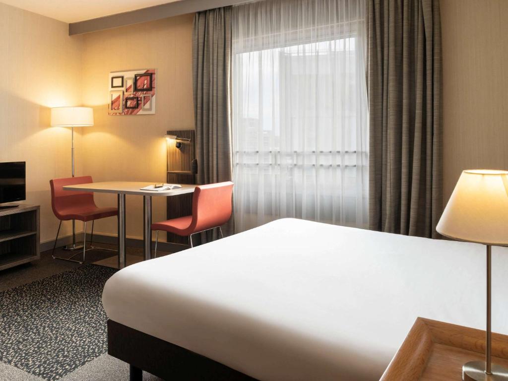 Postel nebo postele na pokoji v ubytování Aparthotel Adagio La Défense Esplanade