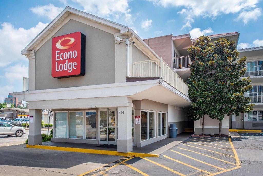 a store with a sign on the side of it at Econo Lodge Downtown in Louisville