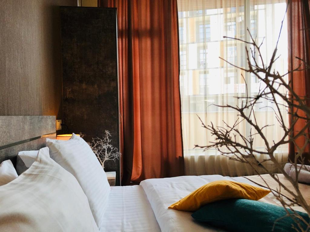 Postel nebo postele na pokoji v ubytování Hotel Nabadi