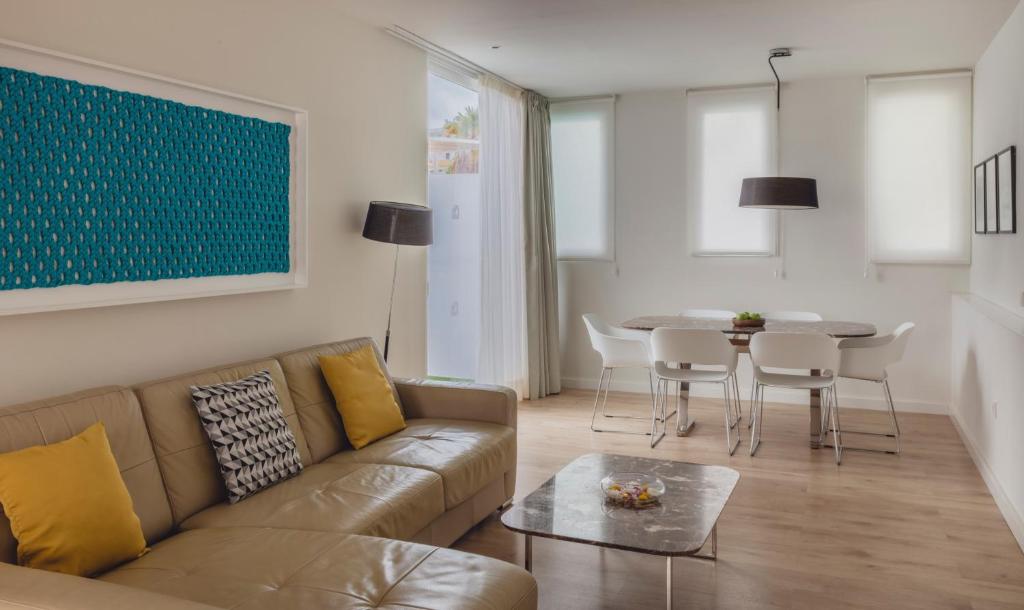 a living room with a couch and a table at Flamingo Beach Mate in Adeje