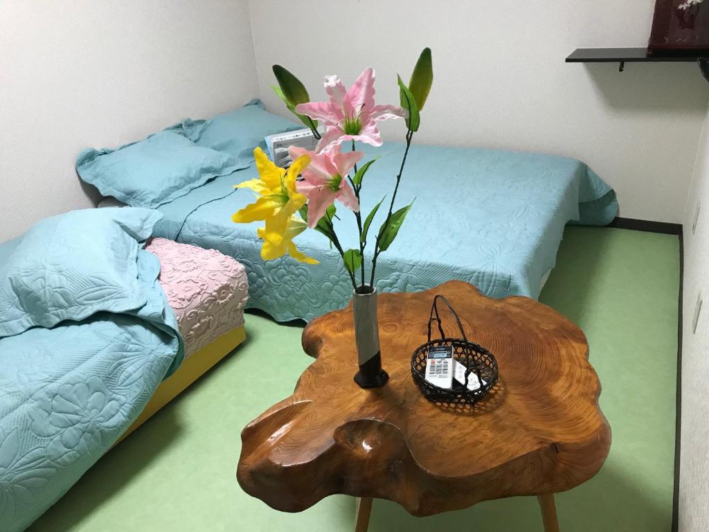 Postel nebo postele na pokoji v ubytování Hotel Wish HANA