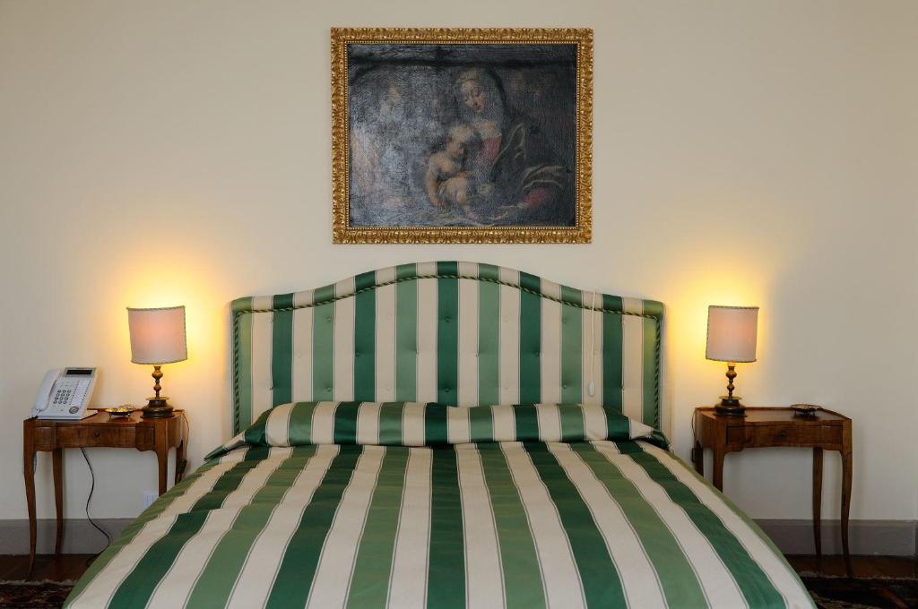 Postel nebo postele na pokoji v ubytování Villa Claudia dei Marchesi Dal Pozzo