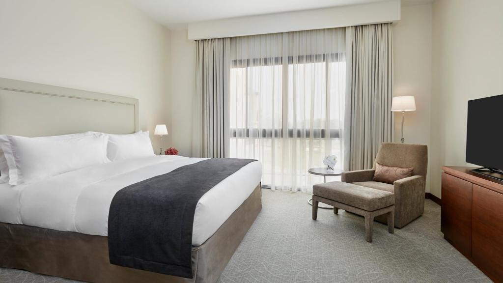 Łóżko lub łóżka w pokoju w obiekcie InterContinental Hotels Doha Residences