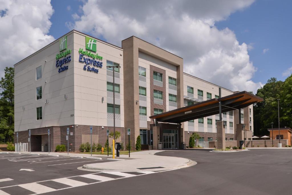 a large white building with a sign on it at Holiday Inn Express & Suites Charlotte - Ballantyne, an IHG Hotel in Charlotte