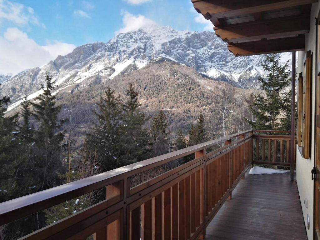 a balcony with a view of a snow covered mountain at Casa Lina S. Pietro in San Pietro