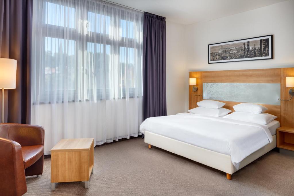 Postel nebo postele na pokoji v ubytování Hermitage Hotel Prague