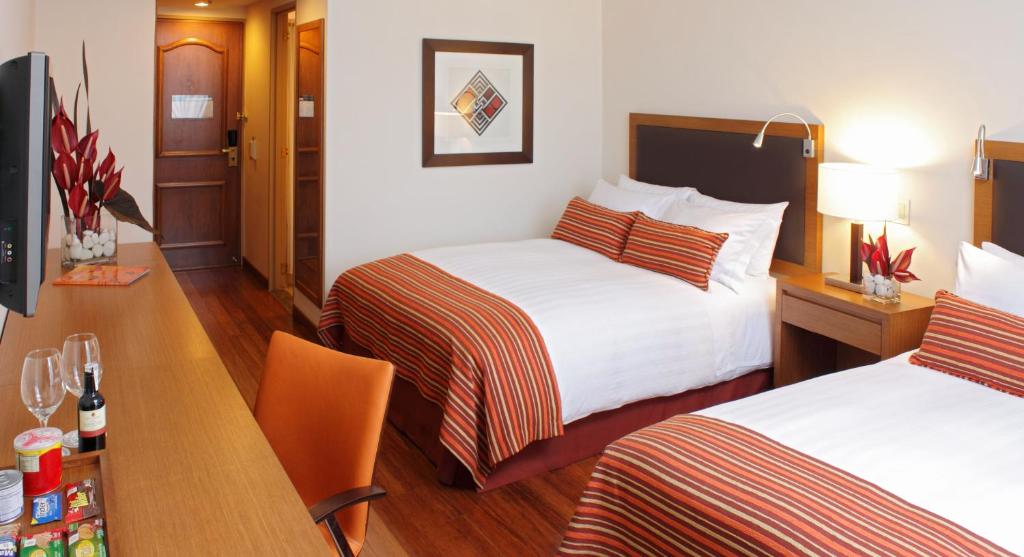 Una cama o camas en una habitación de Hotel Intercontinental Cali by IHG