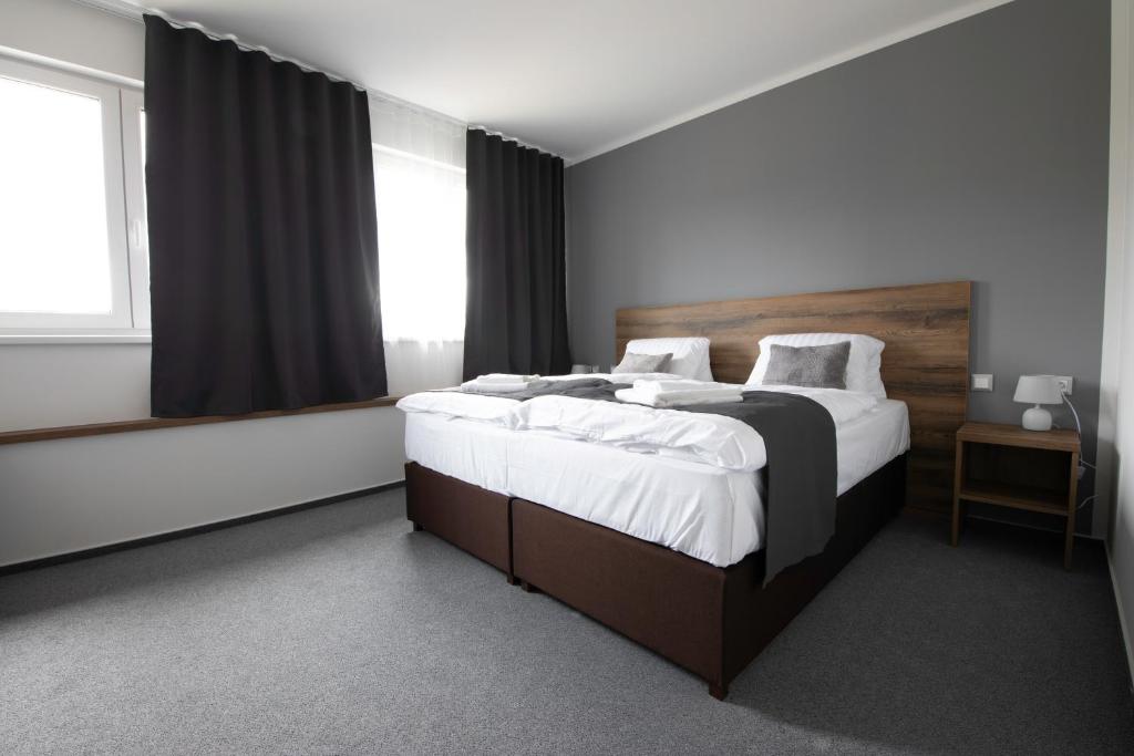 Llit o llits en una habitació de Penzion Glogar