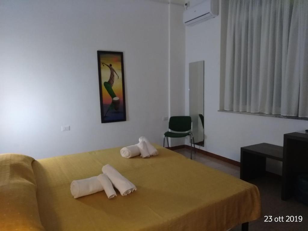 Postel nebo postele na pokoji v ubytování Hotel Virgilio