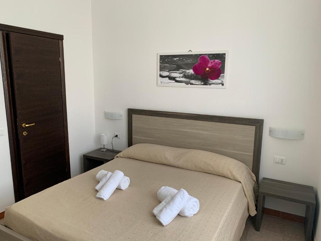 Postel nebo postele na pokoji v ubytování Hotel Virgilio