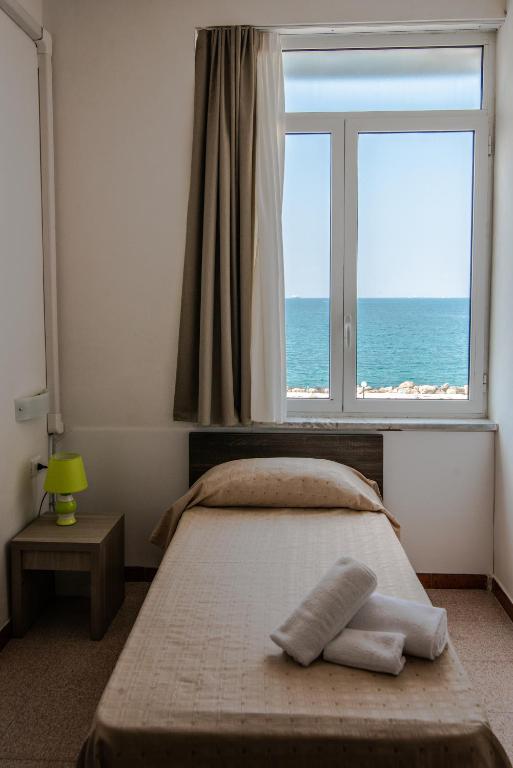 Postel nebo postele na pokoji v ubytování Hotel Virgilio