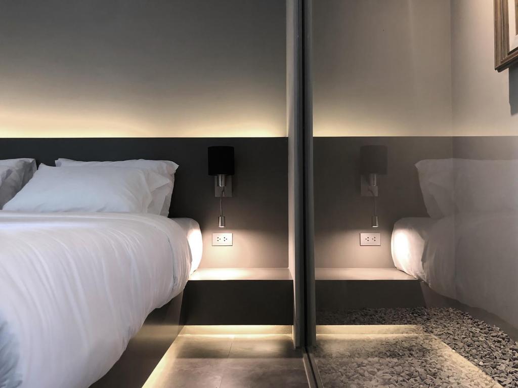 Postel nebo postele na pokoji v ubytování Doowall Hotel