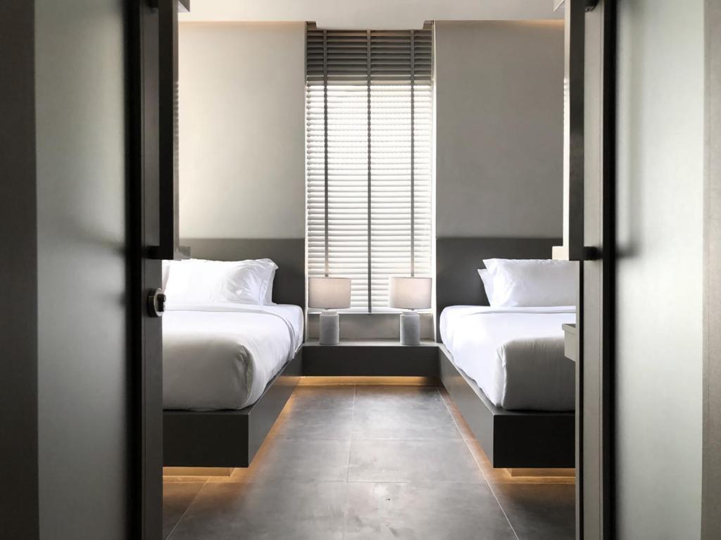 Postel nebo postele na pokoji v ubytování Doowall Hotel