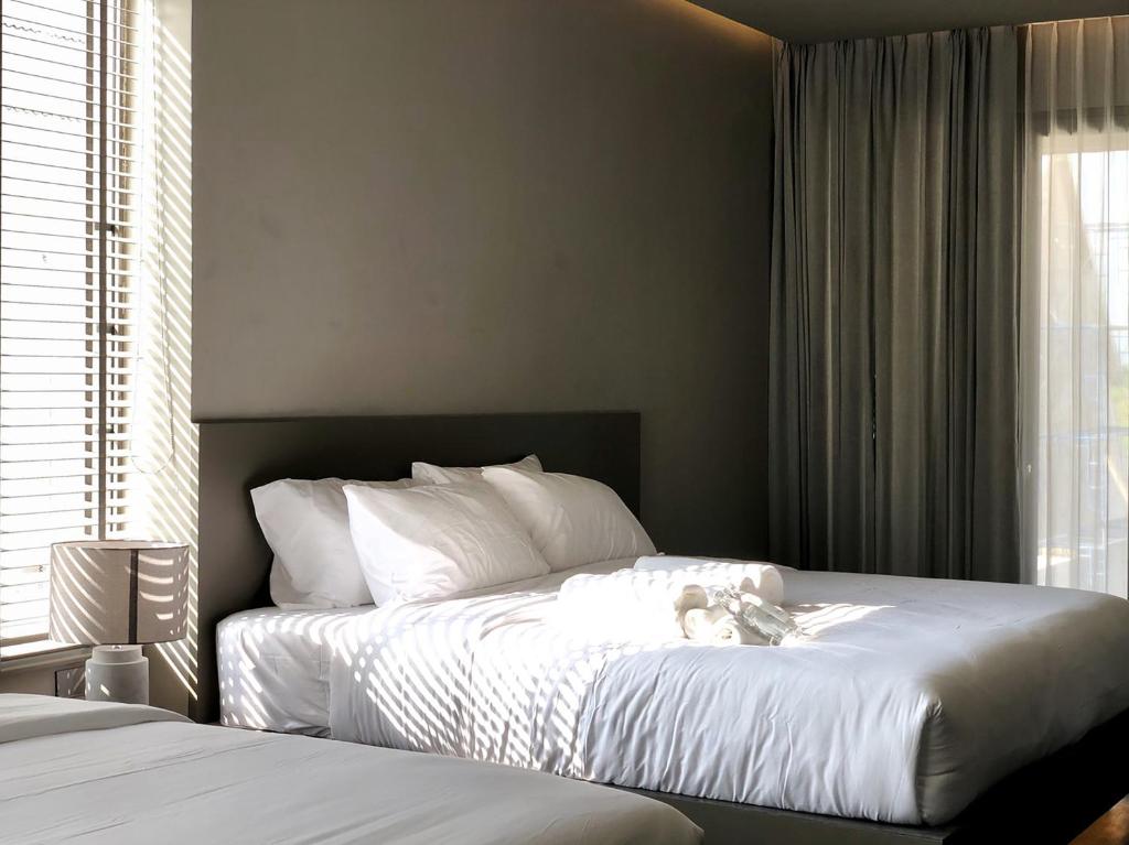 Postel nebo postele na pokoji v ubytování Doowall Hotel