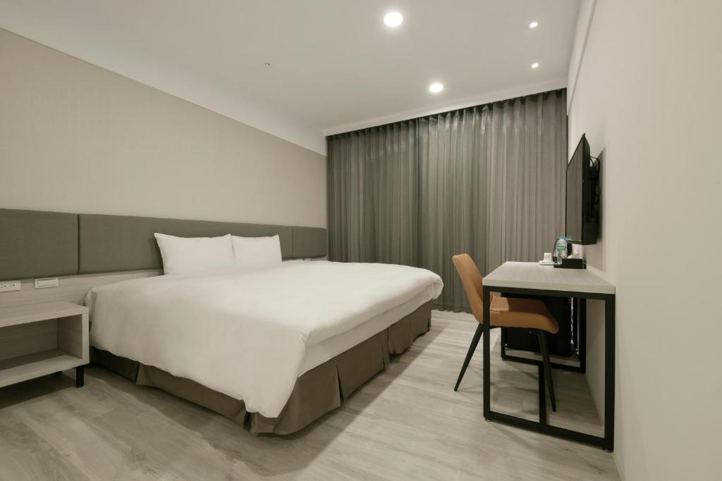 Postel nebo postele na pokoji v ubytování Fengjia JinRui Hotel