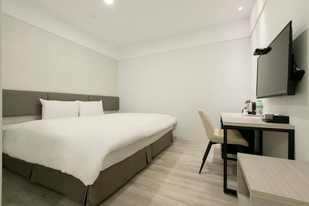 Postel nebo postele na pokoji v ubytování Fengjia JinRui Hotel