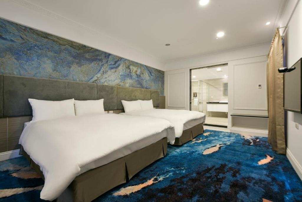 Postel nebo postele na pokoji v ubytování Fengjia JinRui Hotel