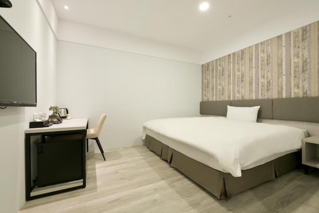 Postel nebo postele na pokoji v ubytování Fengjia JinRui Hotel