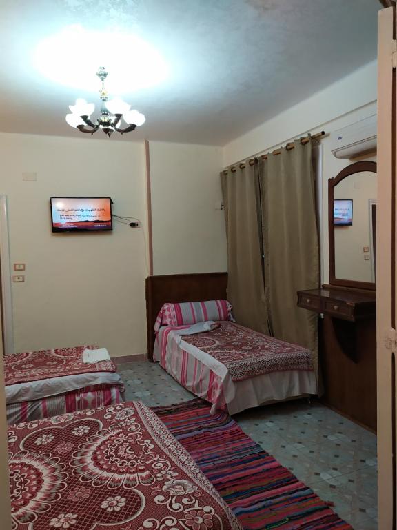 Postel nebo postele na pokoji v ubytování Cairo Moon Hostel