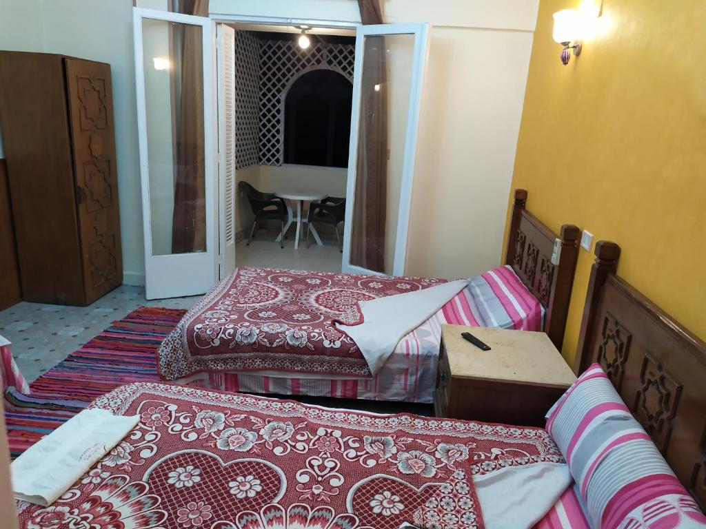 Postel nebo postele na pokoji v ubytování Cairo Moon Hostel