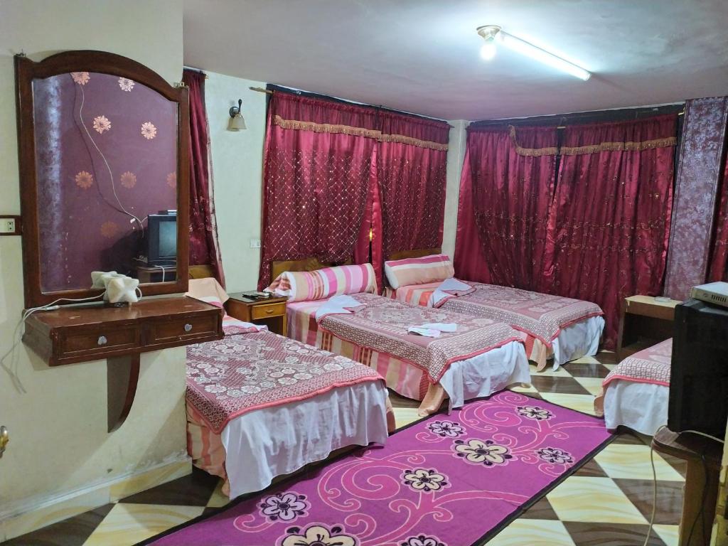 Postel nebo postele na pokoji v ubytování Cairo Moon Hostel