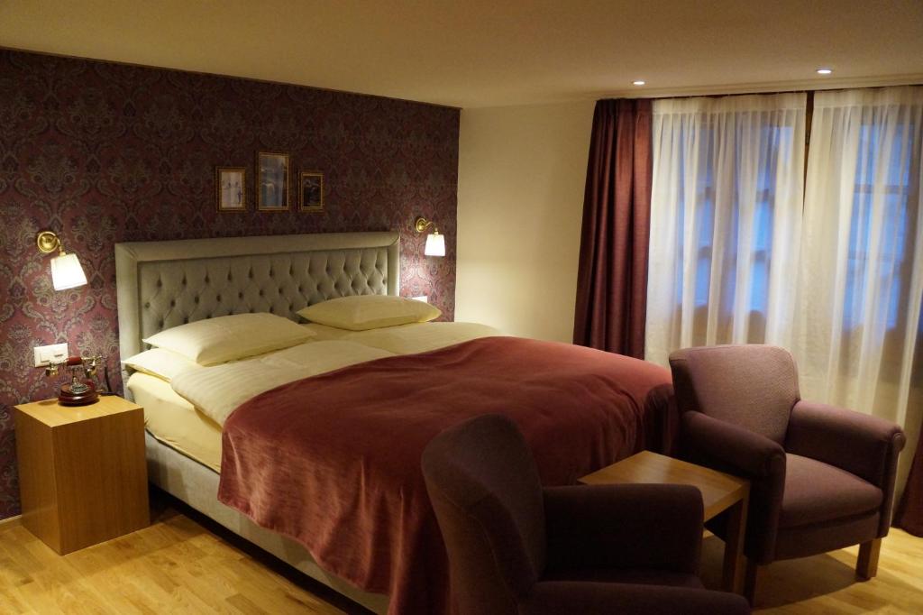 Postel nebo postele na pokoji v ubytování Hotel Walliserhof Zermatt