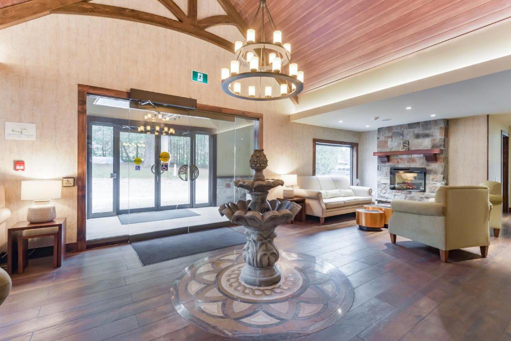 a large living room with a fountain in the middle at Northumberland Heights Wellness Retreat & Spa in Cobourg