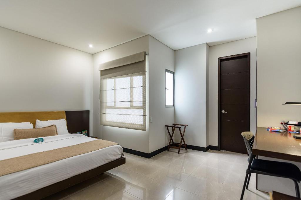 Postel nebo postele na pokoji v ubytování Hotel Lincoln