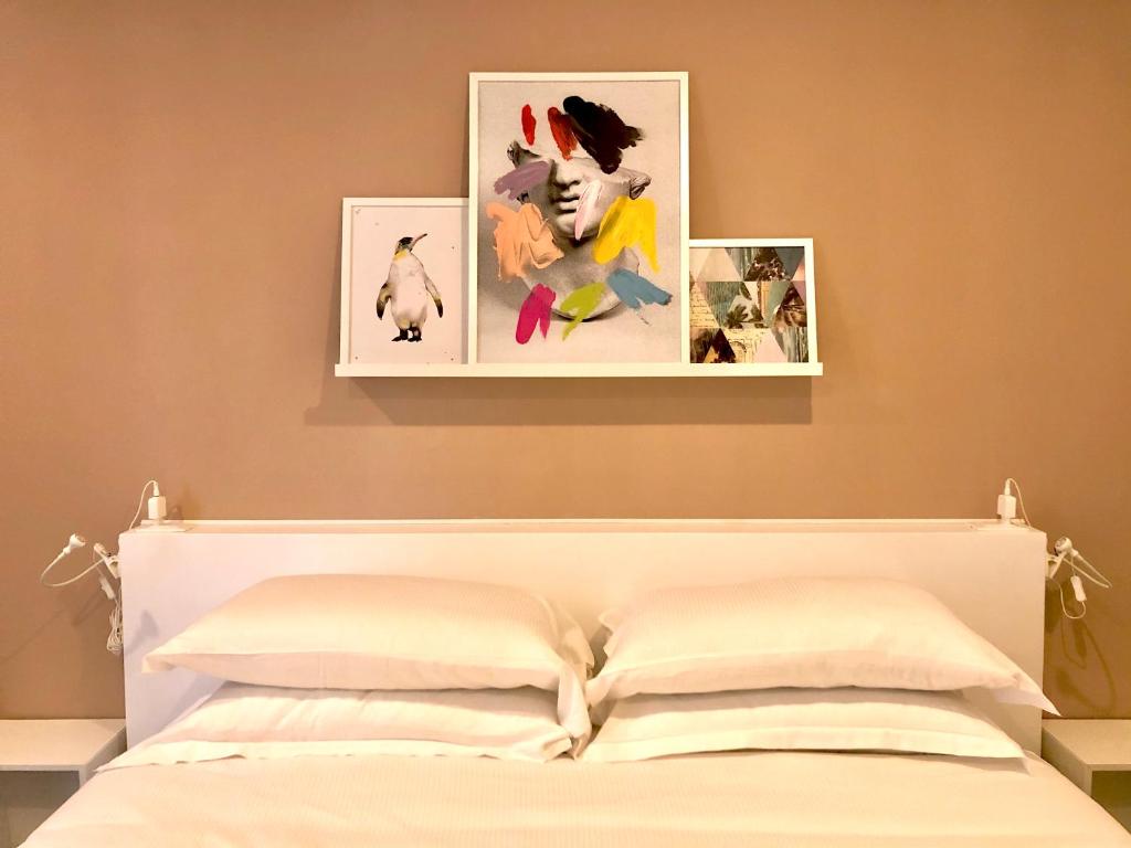 Posteľ alebo postele v izbe v ubytovaní Mimì Rooms&Studios