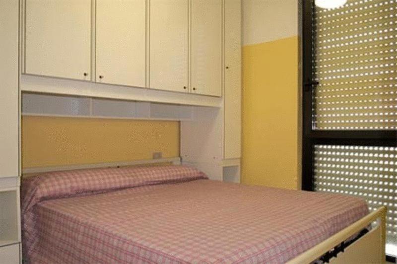 Postel nebo postele na pokoji v ubytování Residence Nettuno