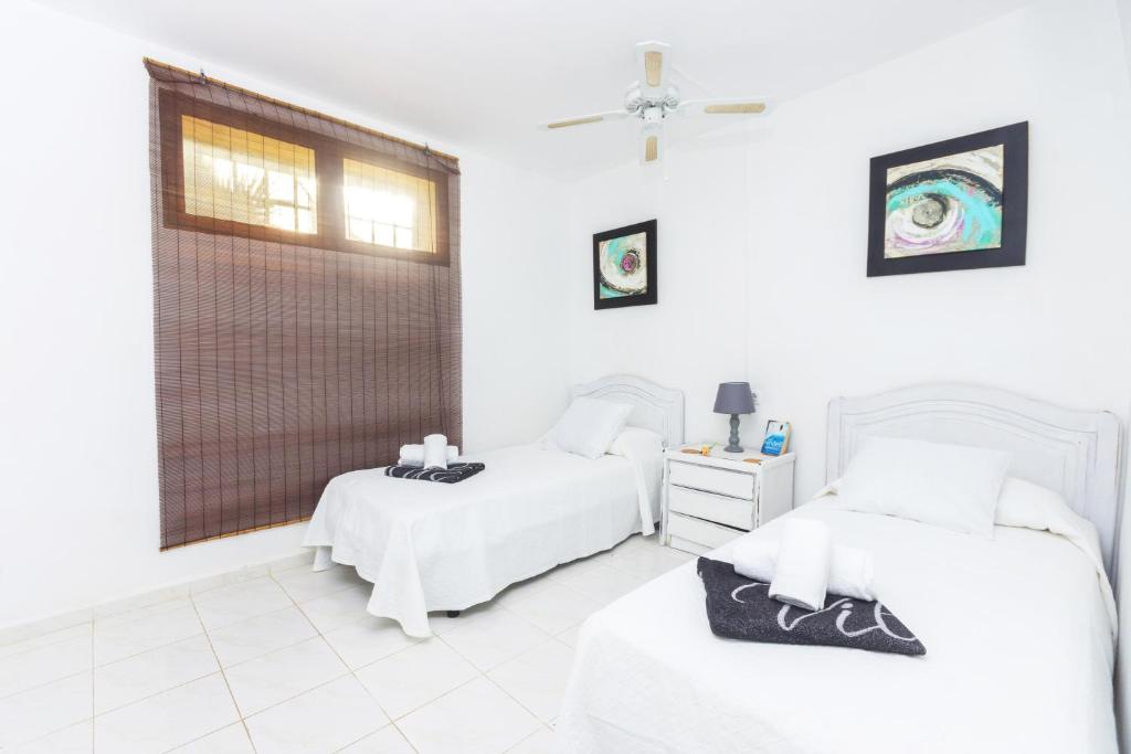 A bed or beds in a room at Jasmin