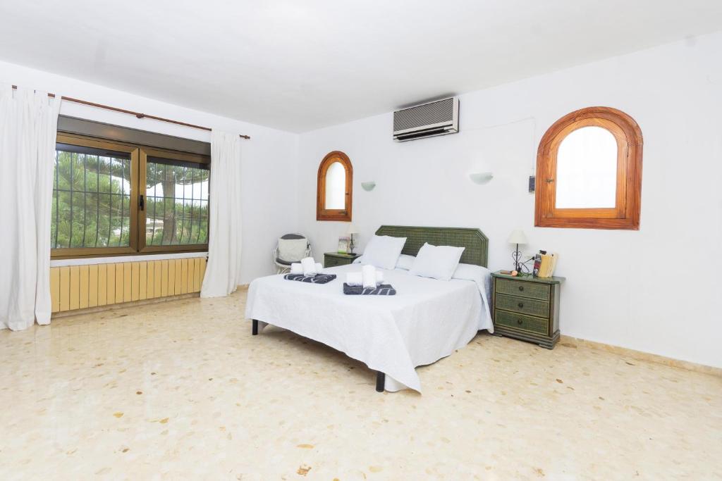 A bed or beds in a room at Jasmin