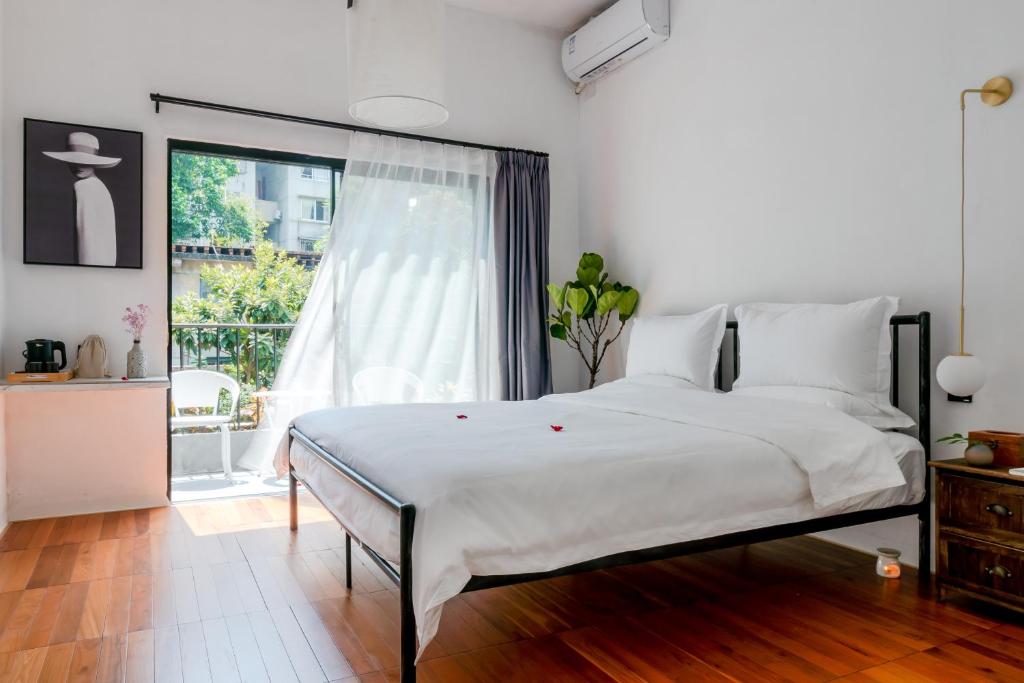 Postel nebo postele na pokoji v ubytování Su Jiu Apartment