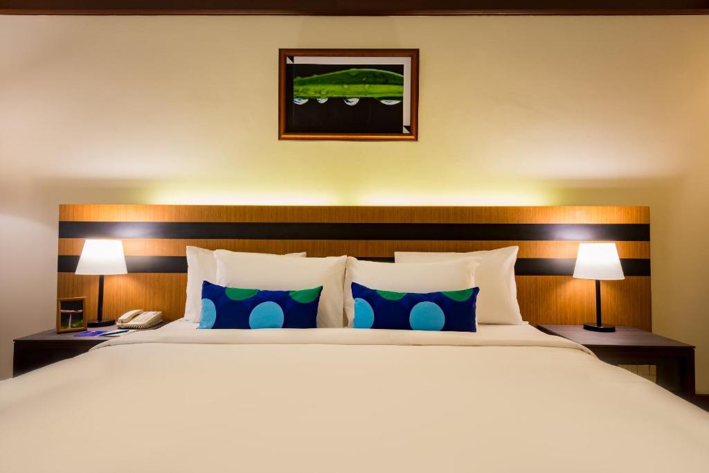 Postel nebo postele na pokoji v ubytování Le Grandeur Palm Resort Johor