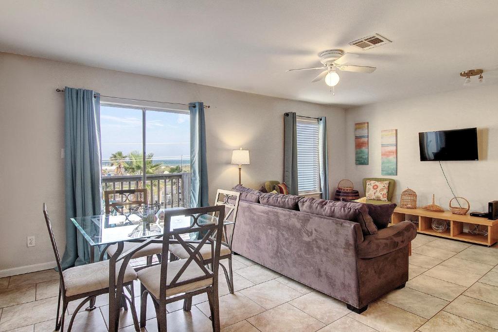 a living room with a couch and a table at Leeward 9303 in Padre Island