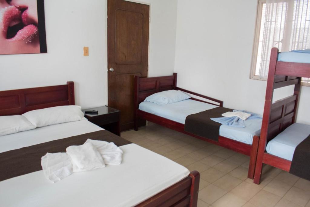 Postel nebo postele na pokoji v ubytování Hotel Joohn Gay only LGBTIQ