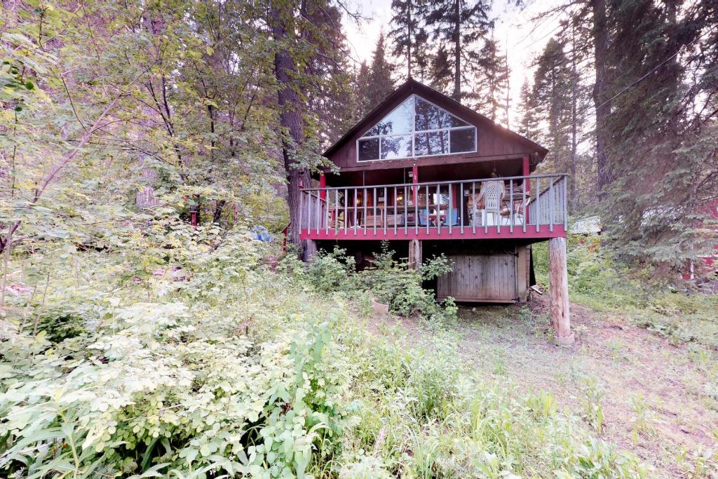 a tree house in the middle of a forest at The Creekside Cabin in Cascade