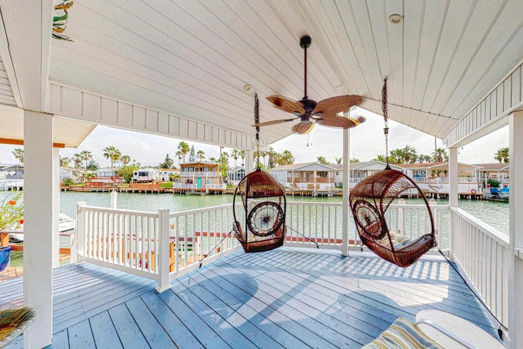 a porch with two hanging hammocks on a house at Long Island Village Unit 658 in Port Isabel