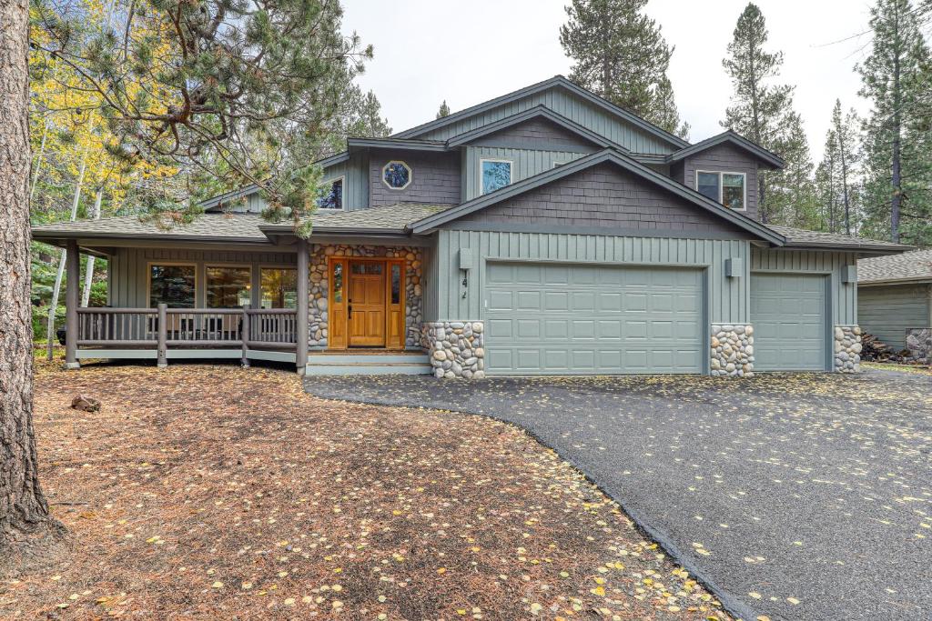 a house with a car garage in front of it at 14 Goldfinch in Sunriver