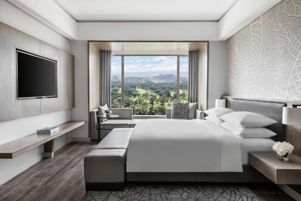 Voodi või voodid majutusasutuse Clark Marriott Hotel toas