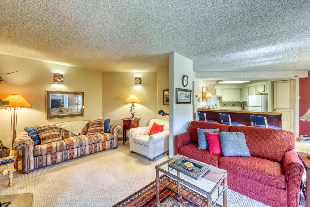 a living room with two couches and a kitchen at Powderhorn Corner & Vista in Breckenridge