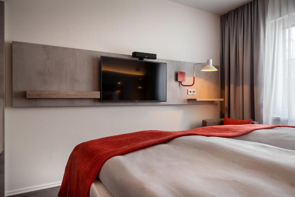 Postel nebo postele na pokoji v ubytování Holiday Inn - the niu, Hide Berlin Friedrichshain by IHG